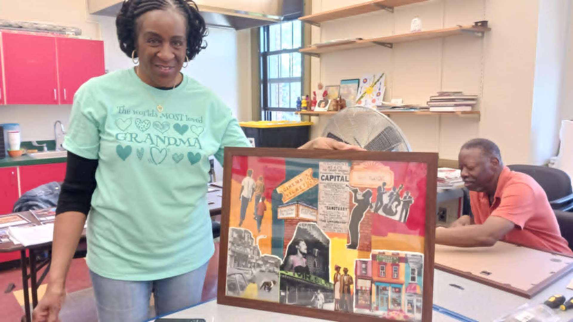Community Artist with Completed Work