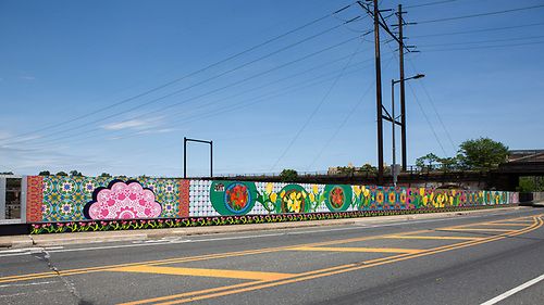 Wide view of the finished Spring Garden Bridge mural along the roadway